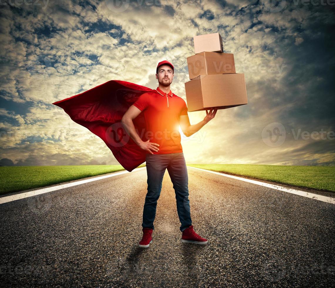 Courier acts like a powerful superhero in a street. Concept of success and guarantee on shipment photo