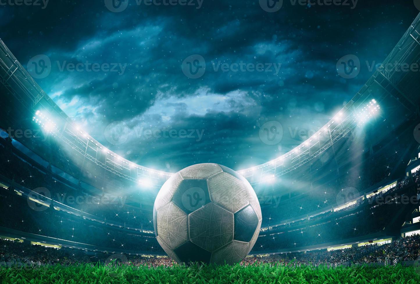 Close up of a soccer ball in the center of the stadium illuminated by the headlights photo
