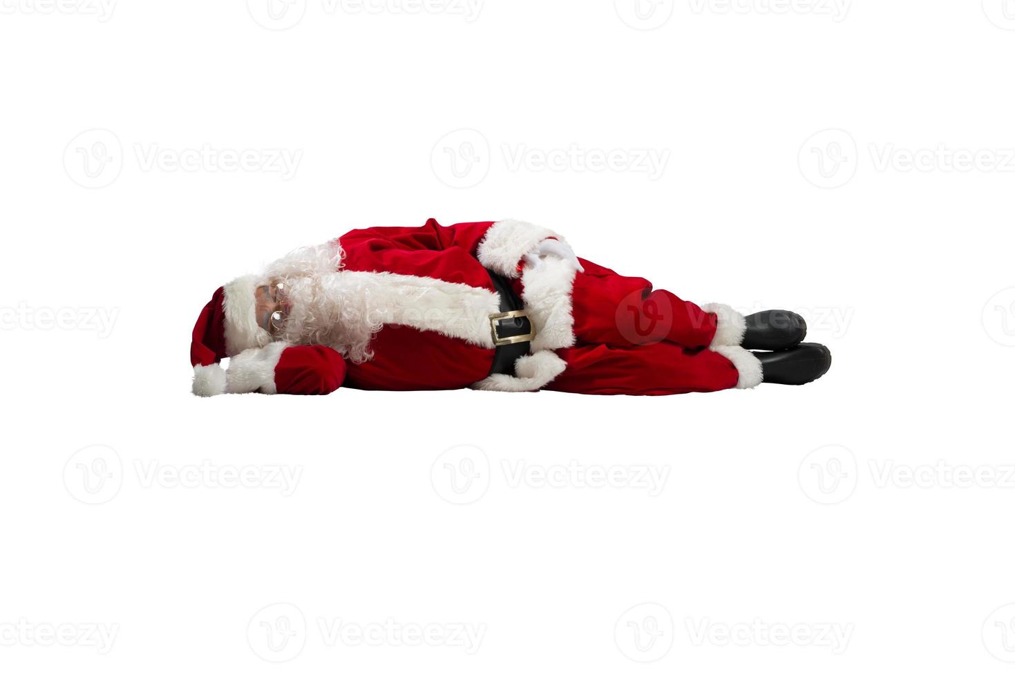 Papa Noel claus es cansado y duerme desde agotamiento foto