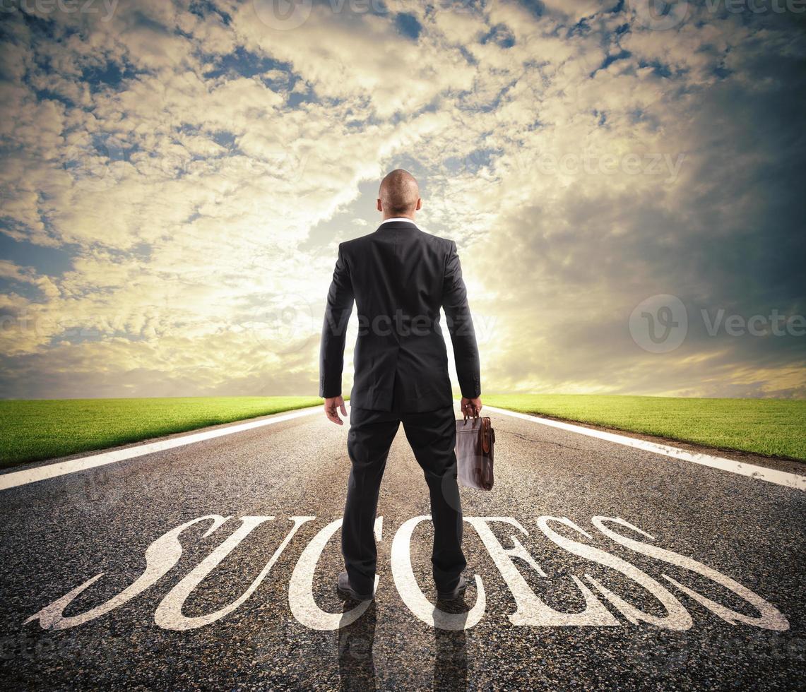 Man walks on a success way. Concept of successful businessman and company startup photo