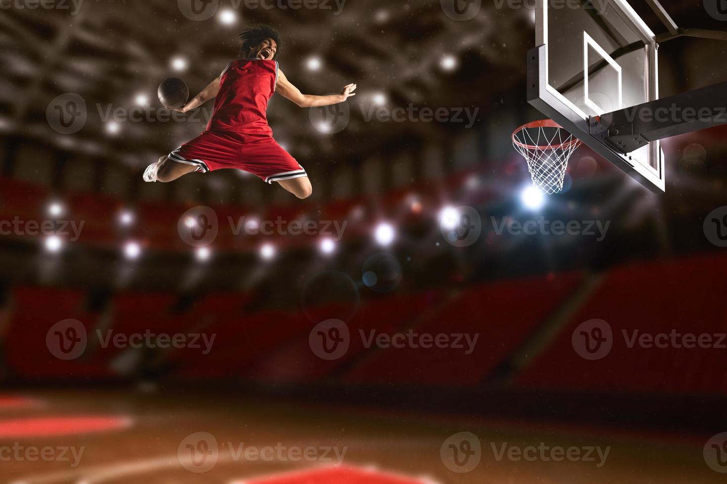 Basketball game with a high jump player to make a slam dunk to the basket photo