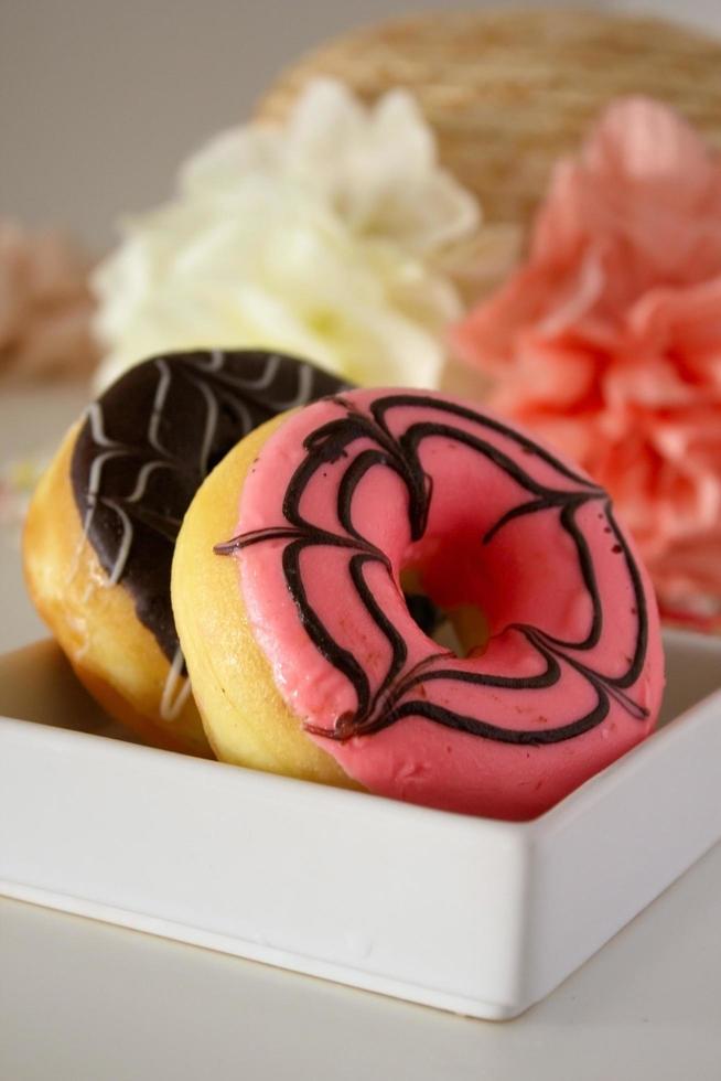 Pink and chocolate donuts. photo