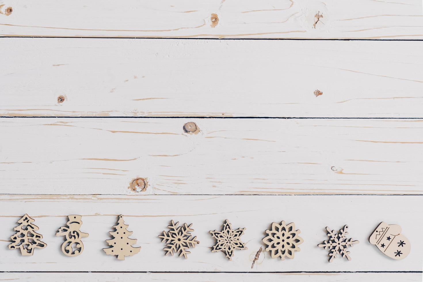 Wooden white and christmas background with snowflakes and christmas decoration. photo