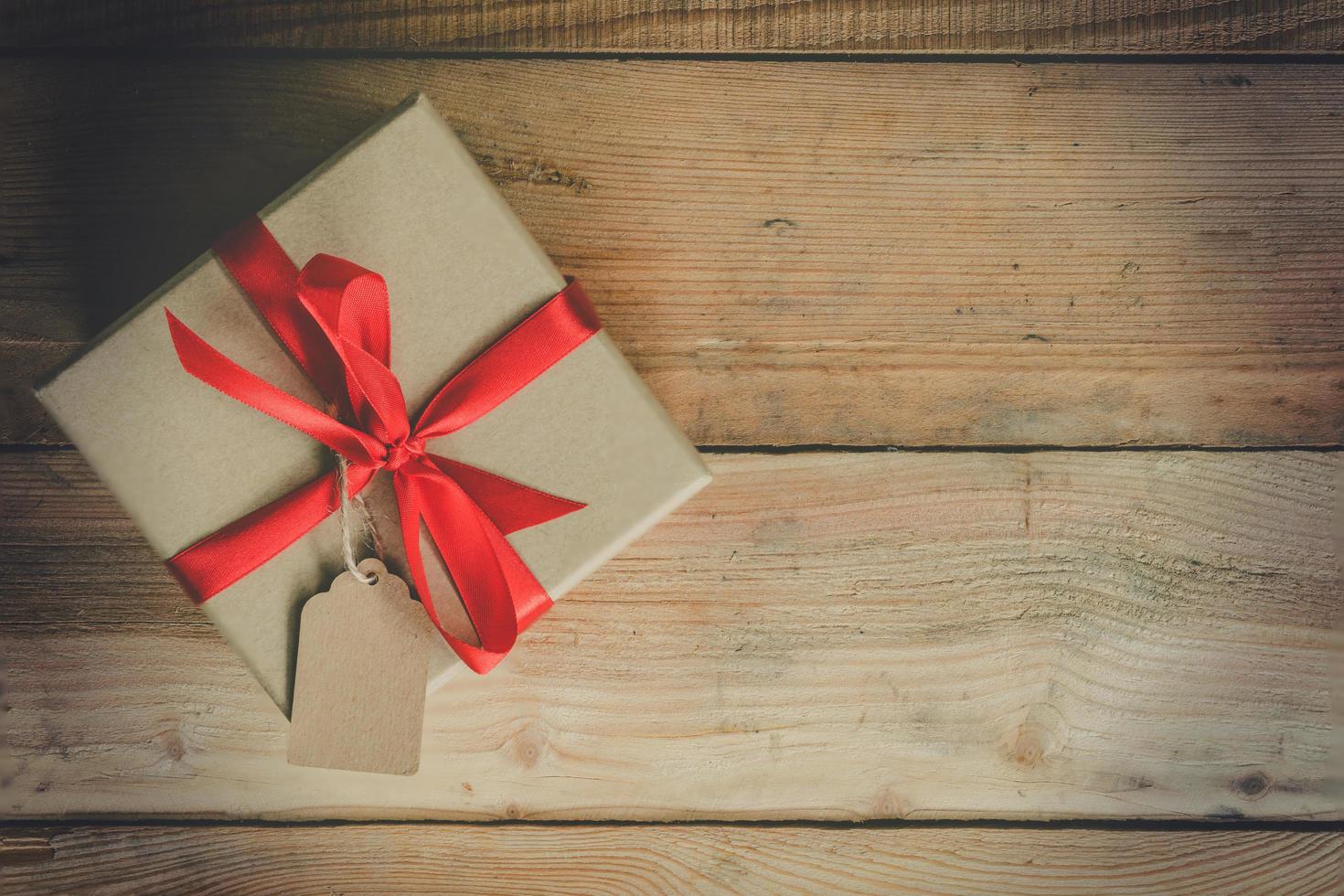 Top view gift box on wood table background with space. photo