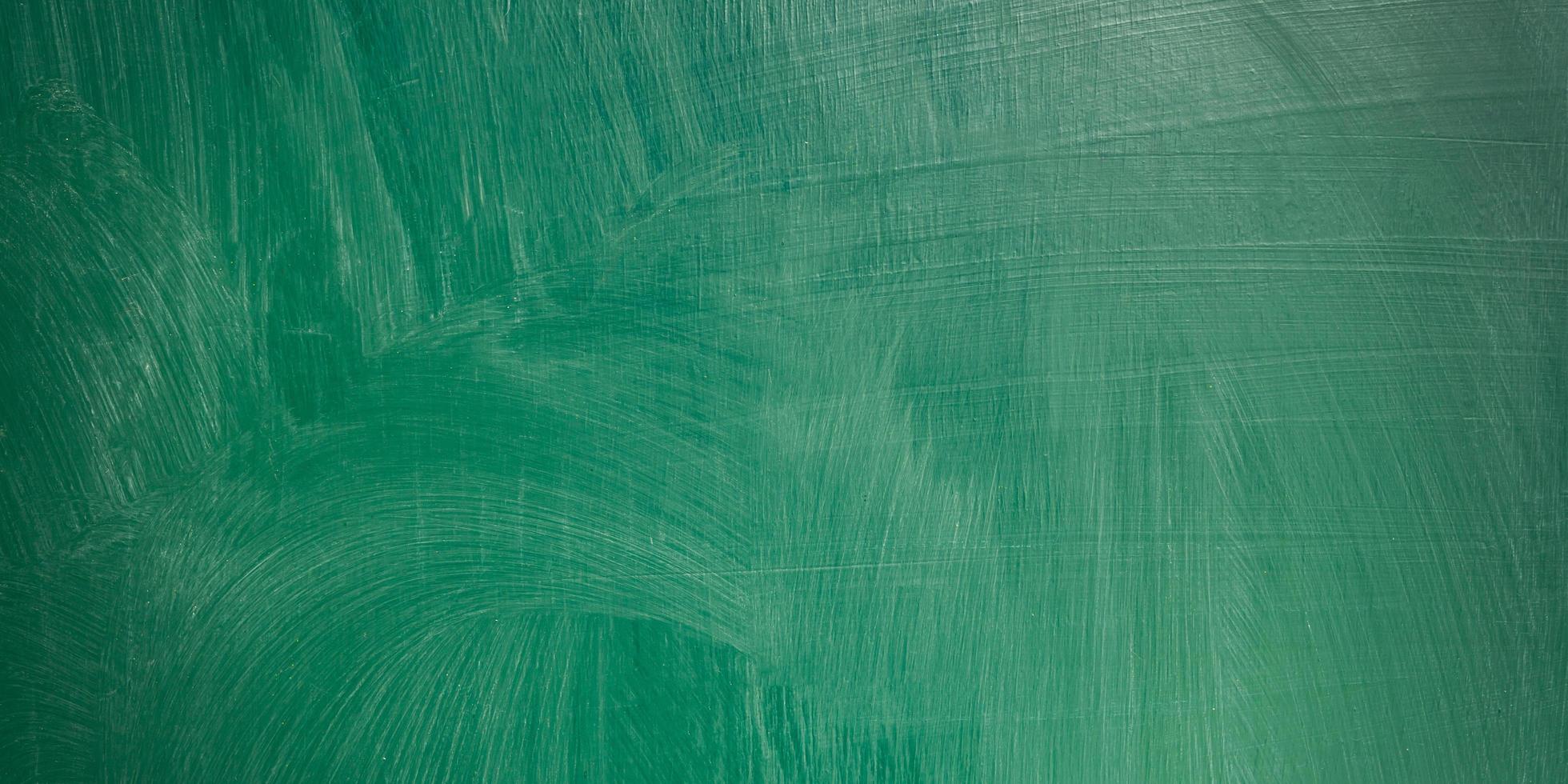 close up of an empty school green chalkboard panorama background. photo