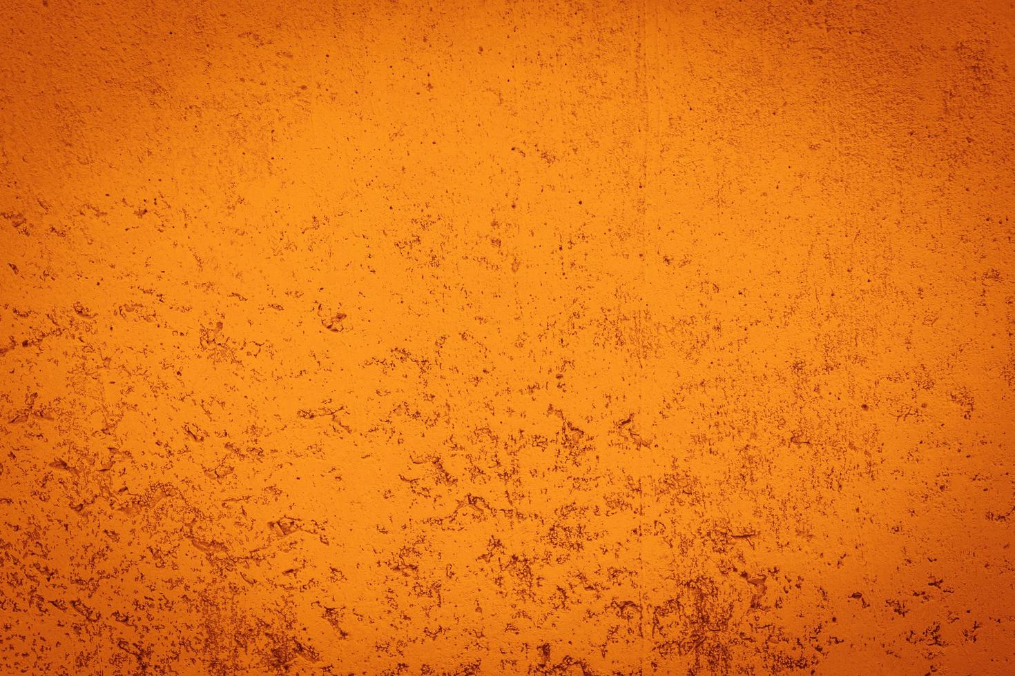 Grunge orange wall concreted wall for interiors texture background. photo