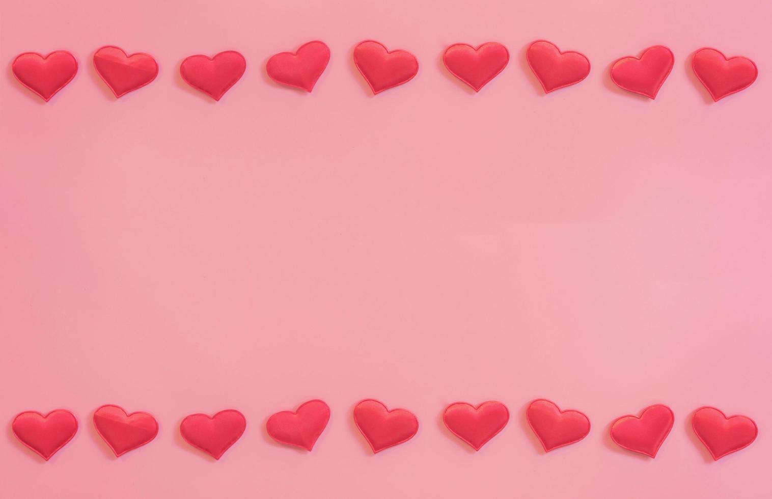 Red heart on pink pastel color background with space for text. photo