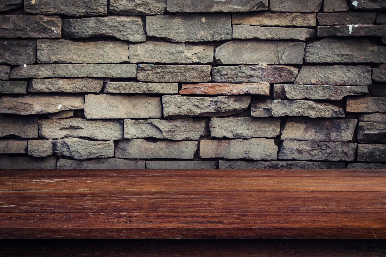 Empty wood table and grunge brick wall and display montage for product. photo