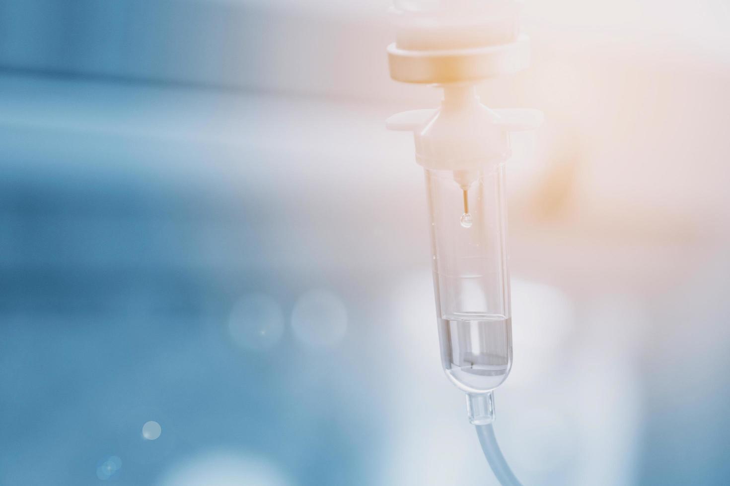 Saline solution drip for treatment patient in the hospital. photo