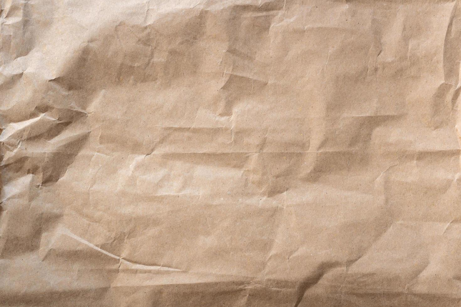 Close up crumpled brown paper texture and background photo