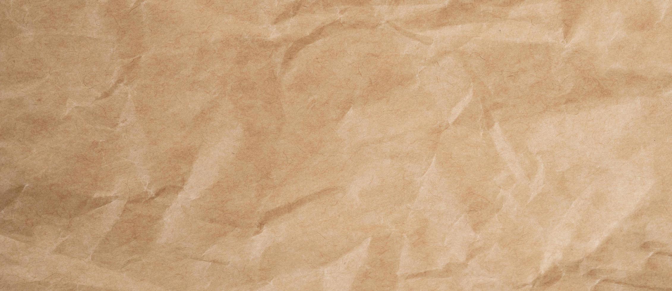 Close up crumpled brown paper texture and background with copy space photo