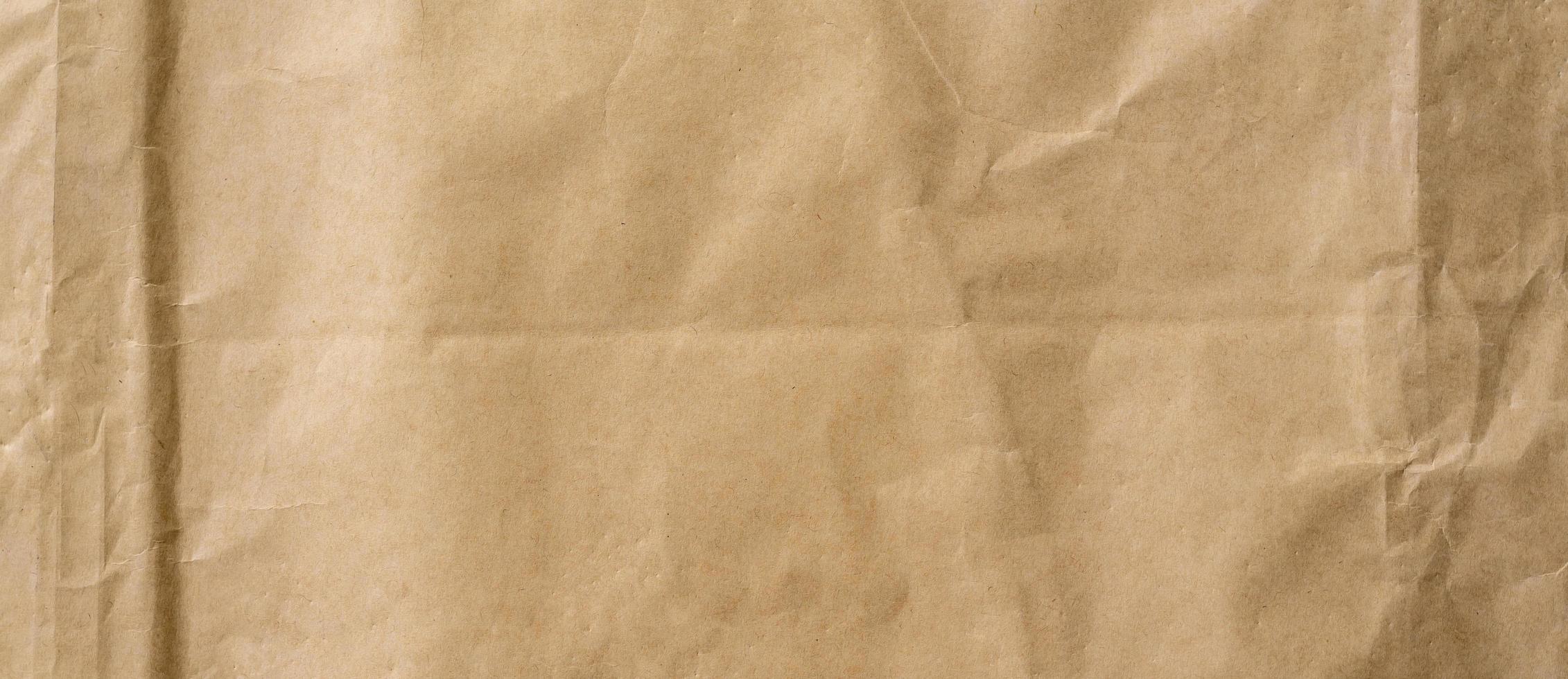 crumpled brown paper background and texture with copy  space. photo