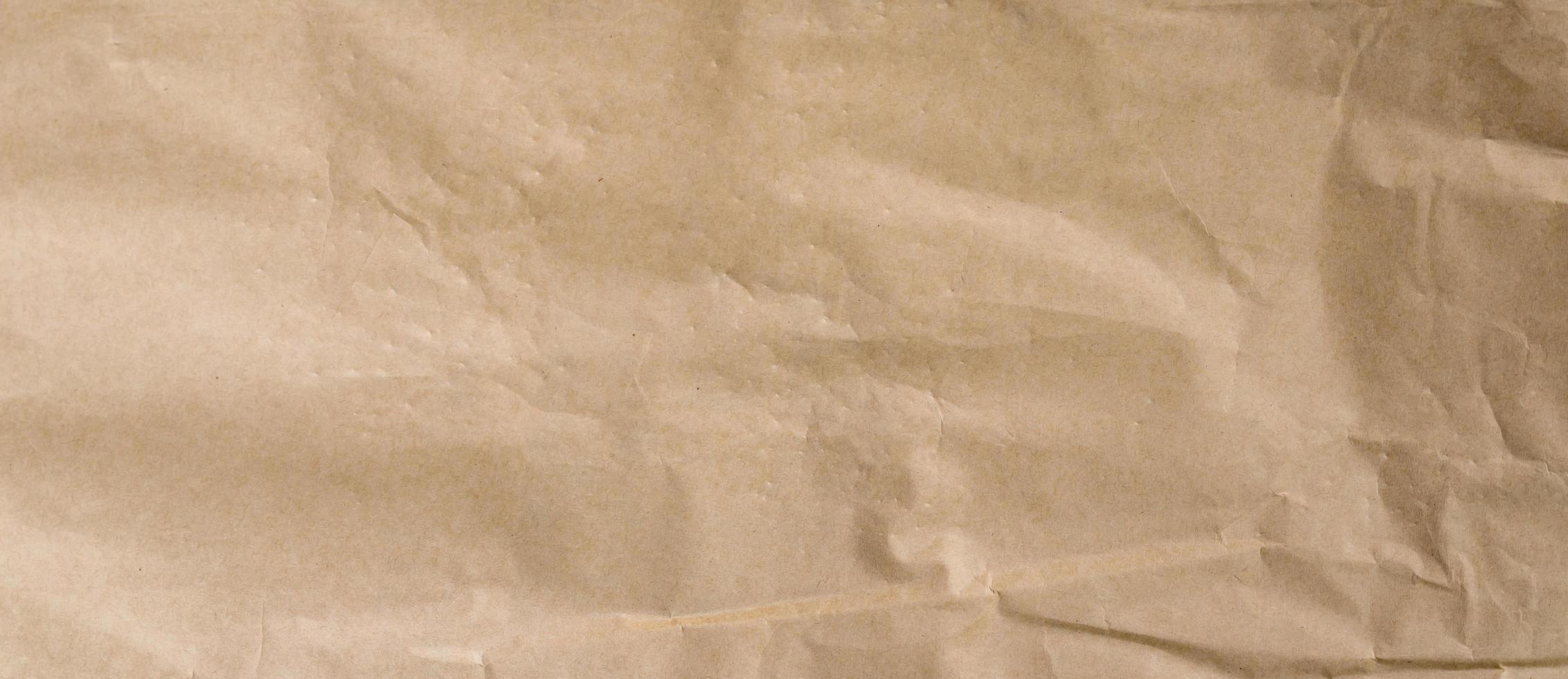 crumpled brown paper background and texture with copy  space. photo