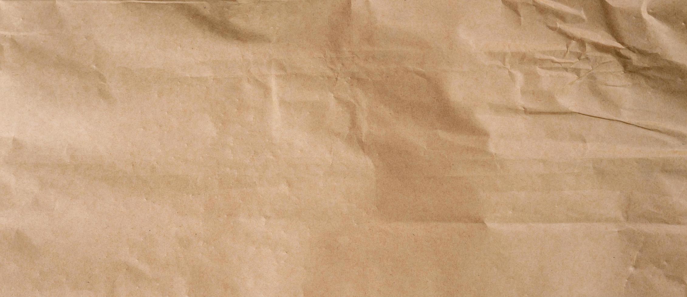 crumpled brown paper background and texture with copy  space. photo