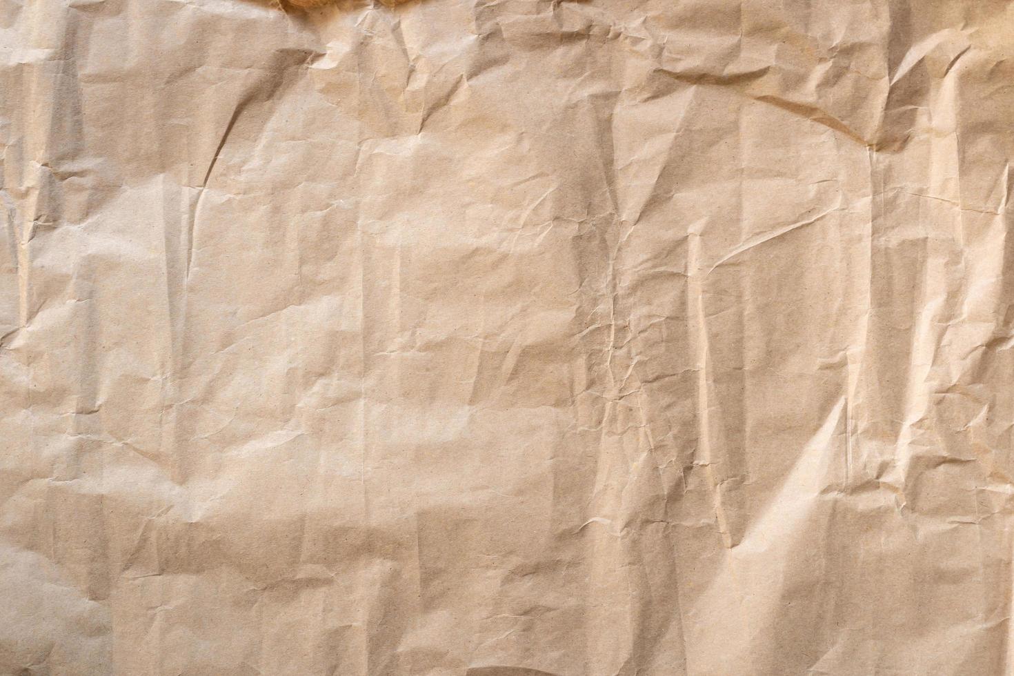 Close up crumpled brown paper texture and background photo