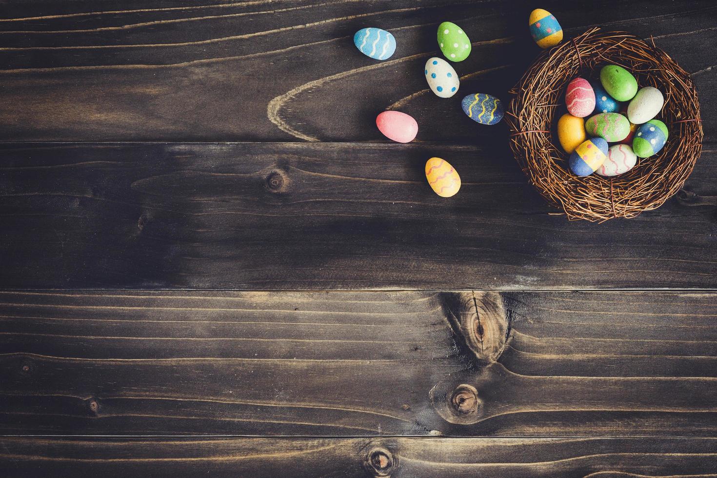 Eggs easter in the nest on wood background with copyspace. photo