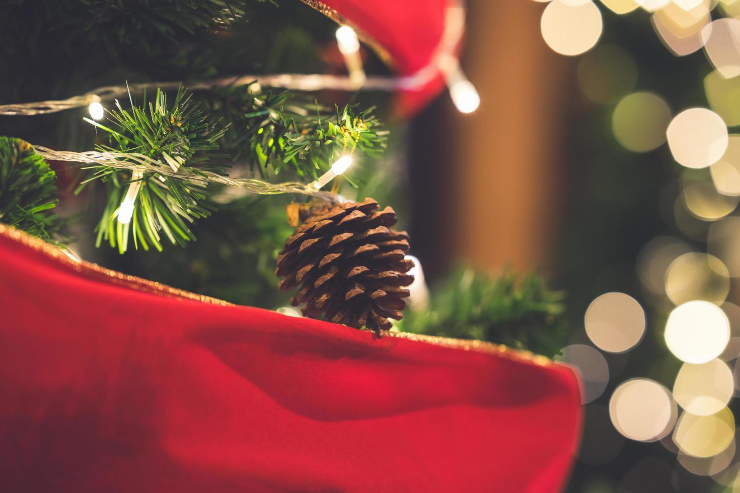 Closeup of christmas pine cones hanging from Christmas tree. photo