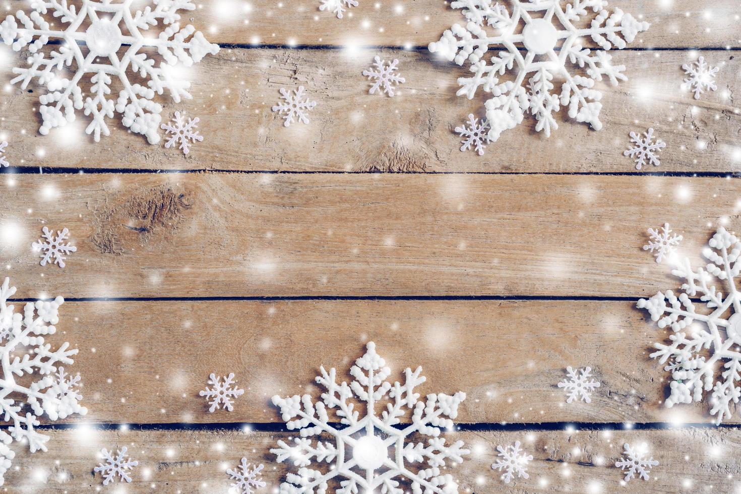 Wooden brown christmas background and white snow with snowflakes, copy space. photo