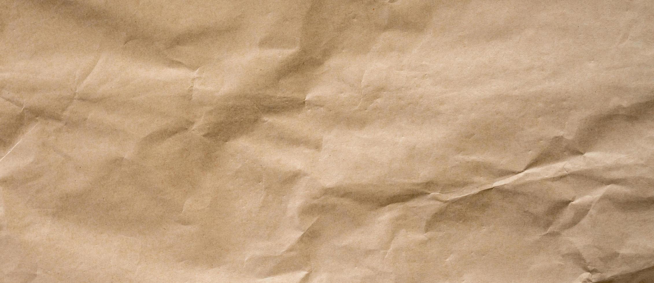 crumpled brown paper background and texture with copy  space. photo