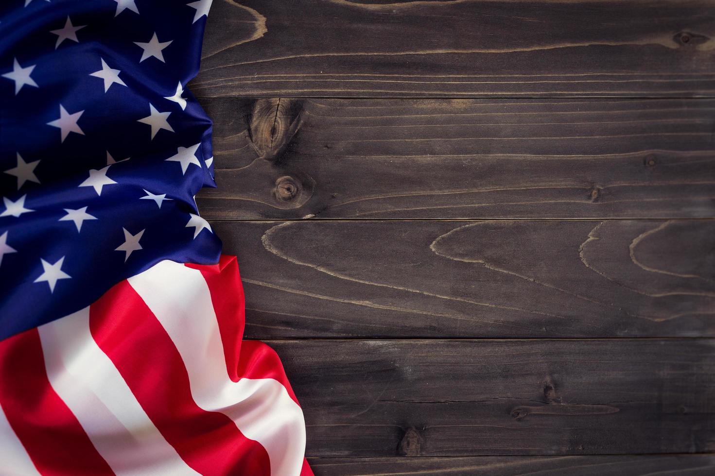 USA flag on wooden wall background and texture with space photo