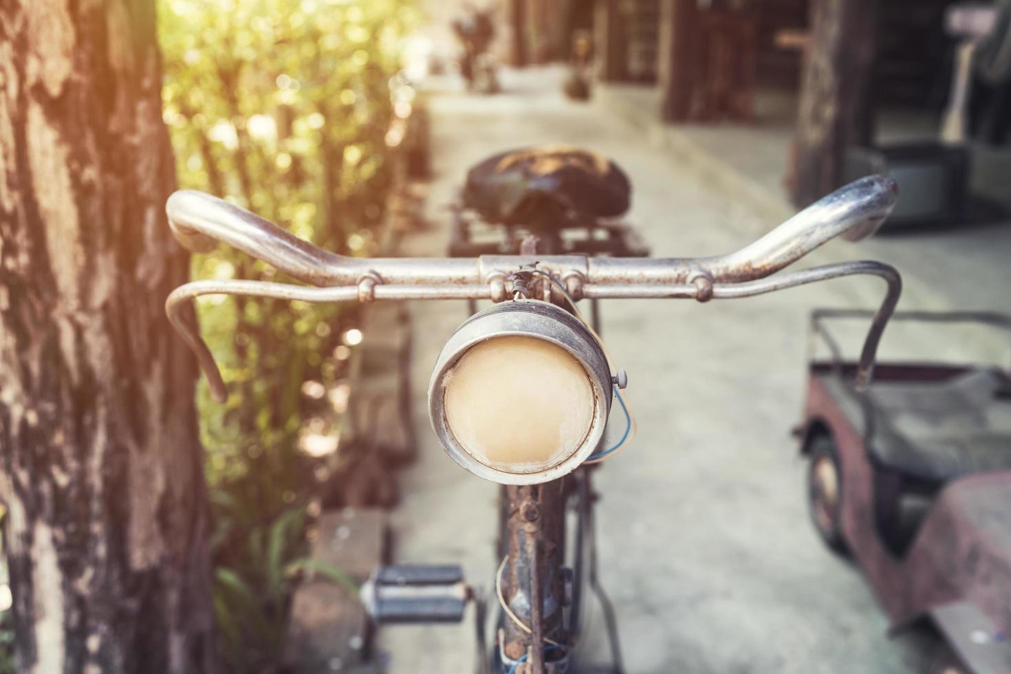 old vintage bicycle and light in garden photo