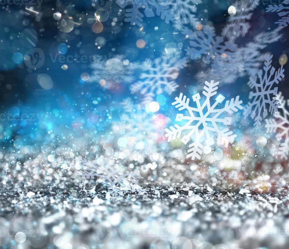 Abstract glowing Christmas blue background with snowflakes photo