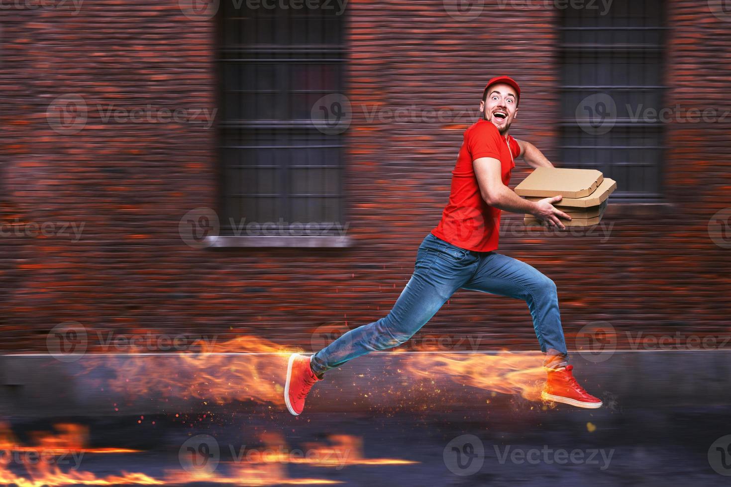 Courier runs fast to deliver quickly pizzas with fiery feet. Cyan background photo