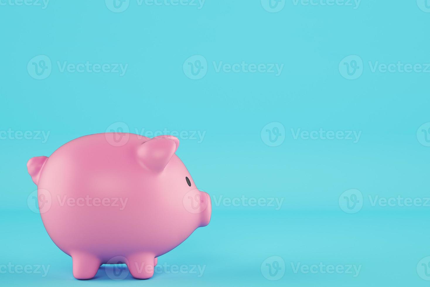 Pink piggy bank isolated on cyan background photo
