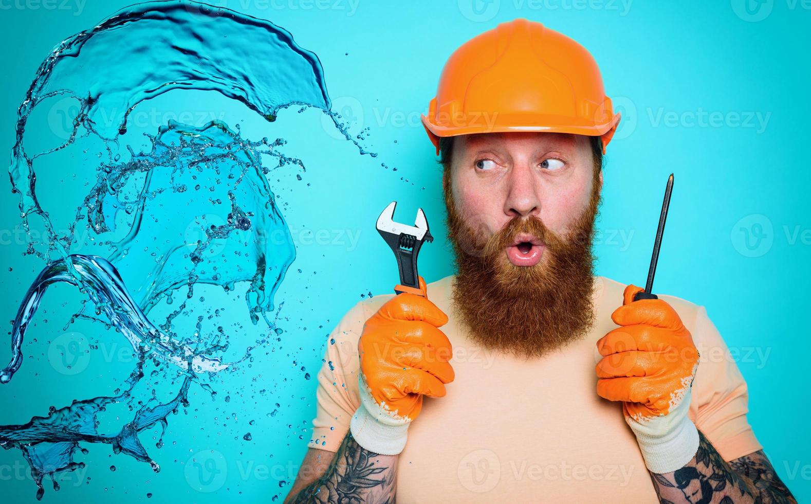 Incompetent worker plumber is unsure about his work. cyan background photo