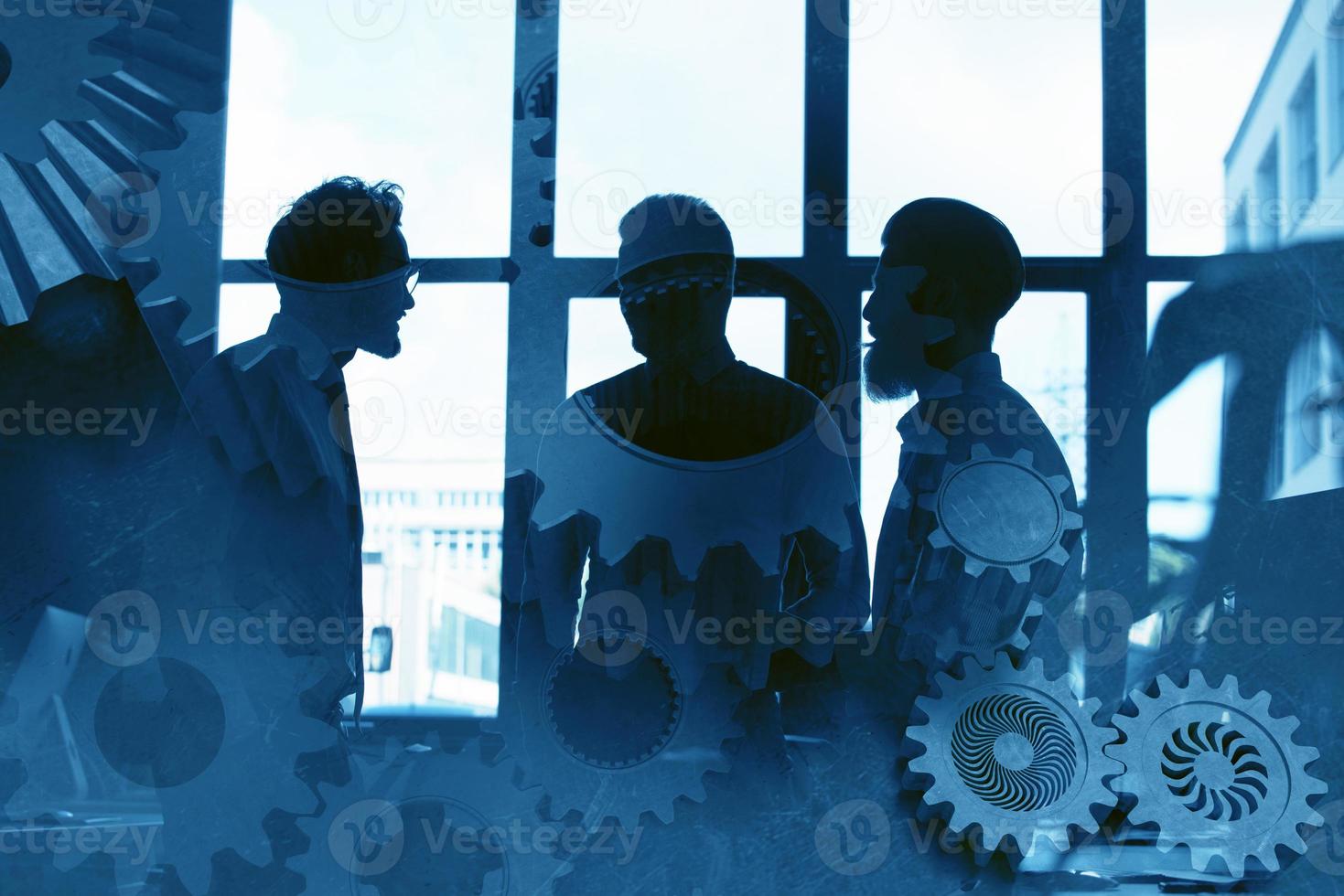 Business team with gears system. Teamwork, partnership and integration concept. double exposure photo