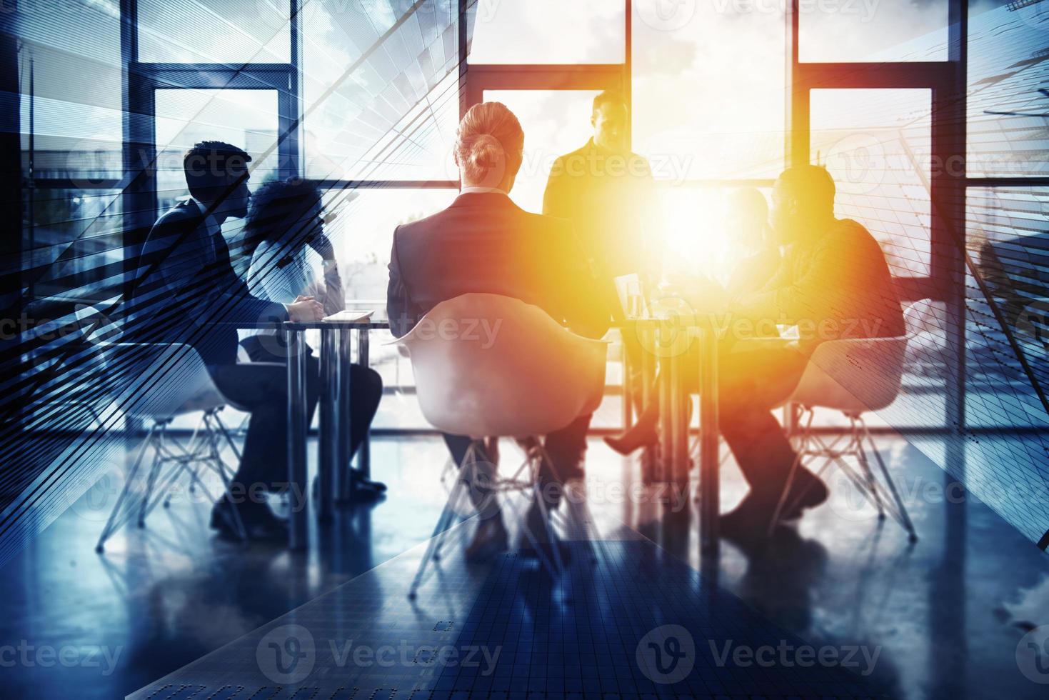 Business background concept with people silhouette working in the office. Double exposure effects photo