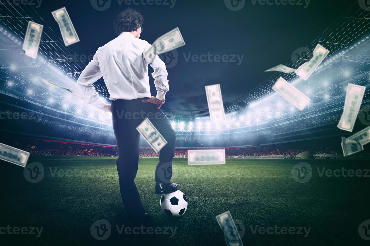 Confident businessman in the center of the soccer field collects a lot of money from the football photo