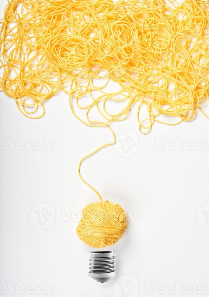 Concept of idea and innovation with wool ball photo