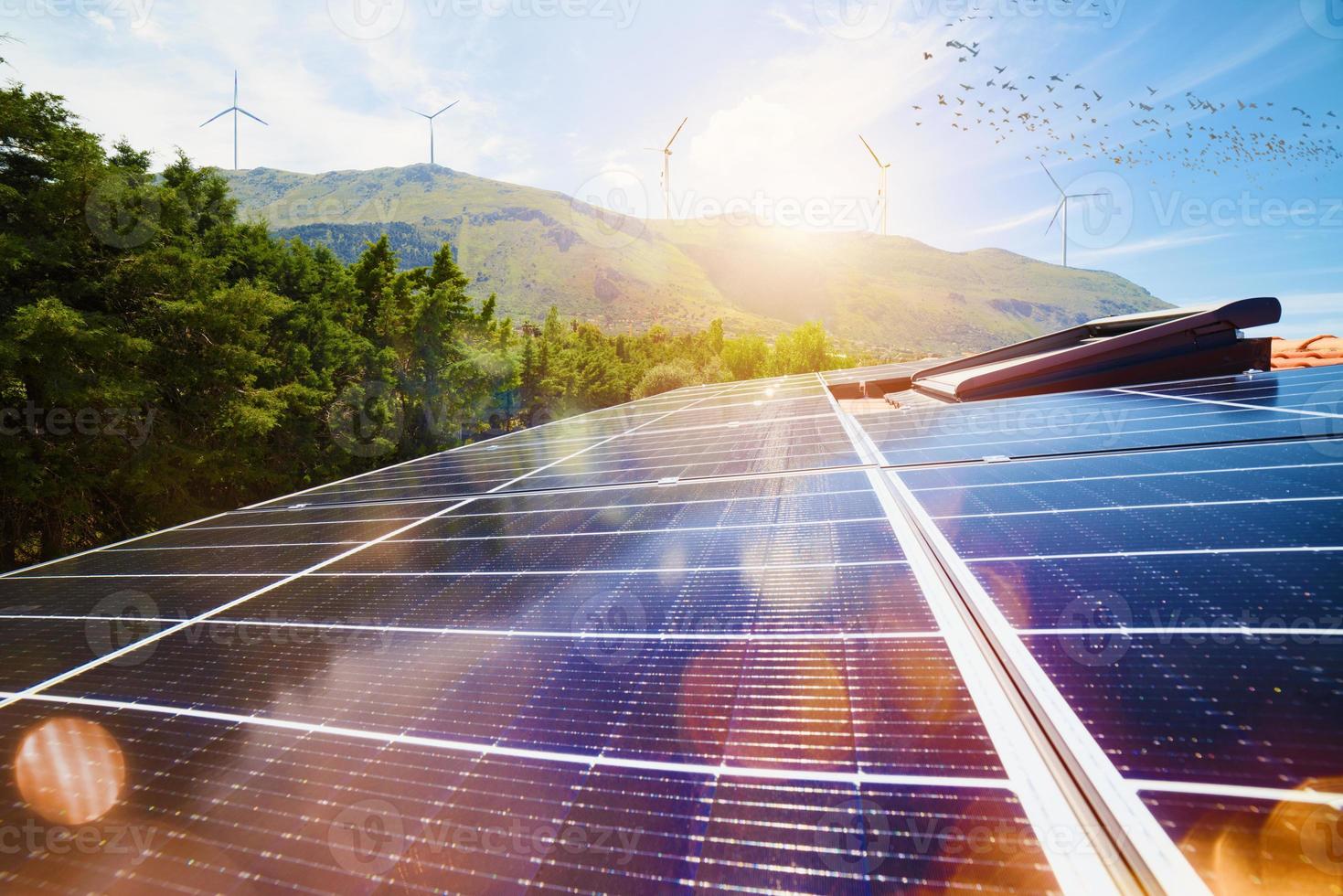 Renewable energy system with solar panel on the roof photo