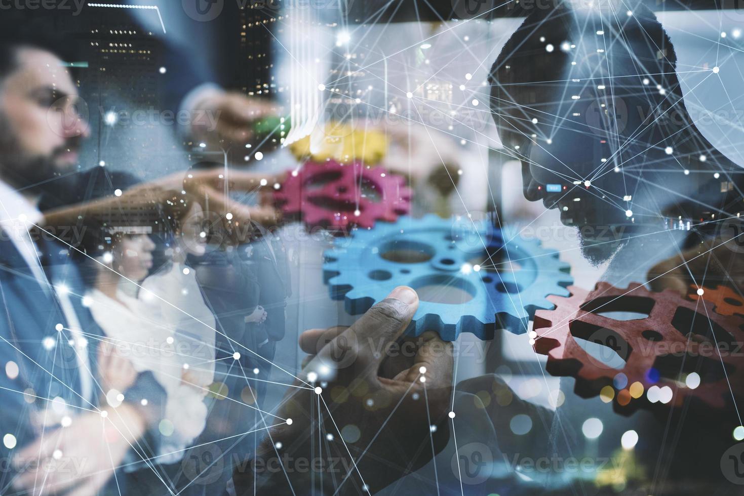 Business team connect pieces of gears. Teamwork, partnership and integration concept. double exposure photo