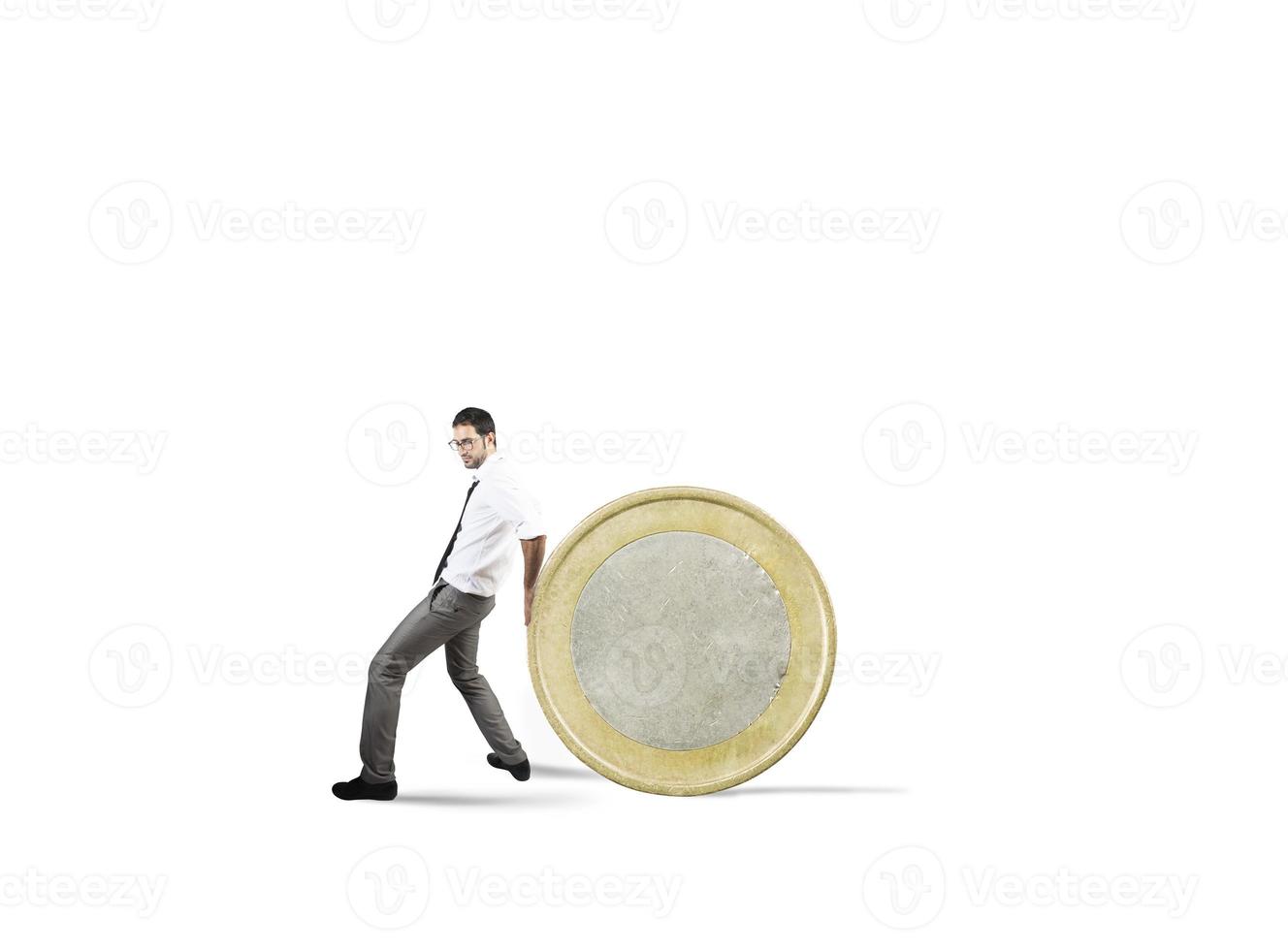 Businessman moves a coin. concept of difficulty to saving money photo