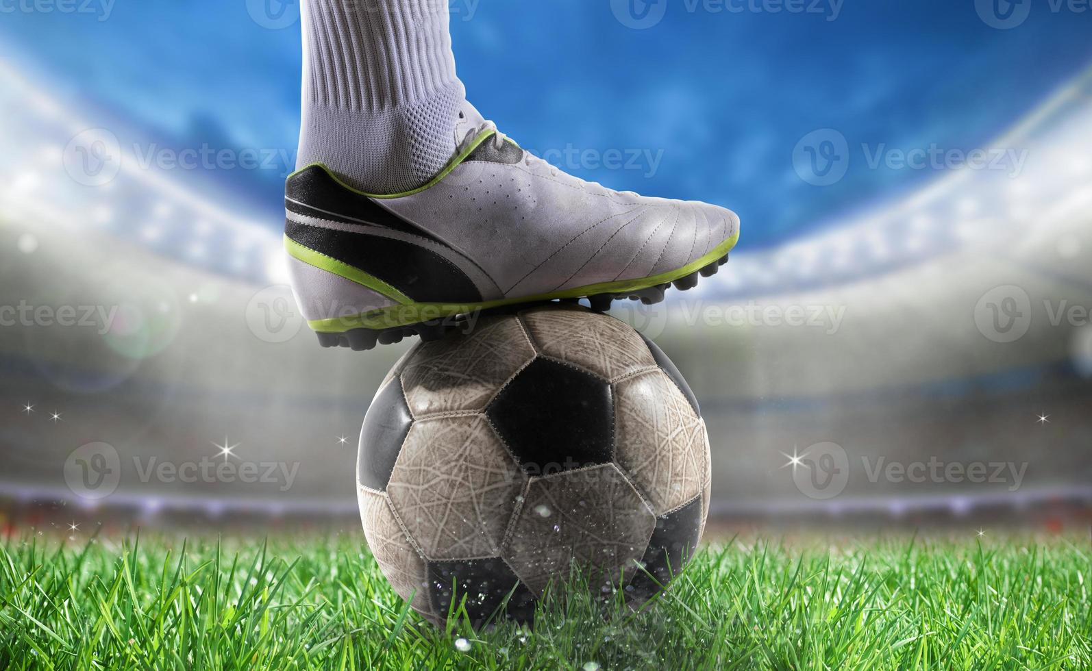 Soccer player with soccerball at the stadium ready for World cup photo