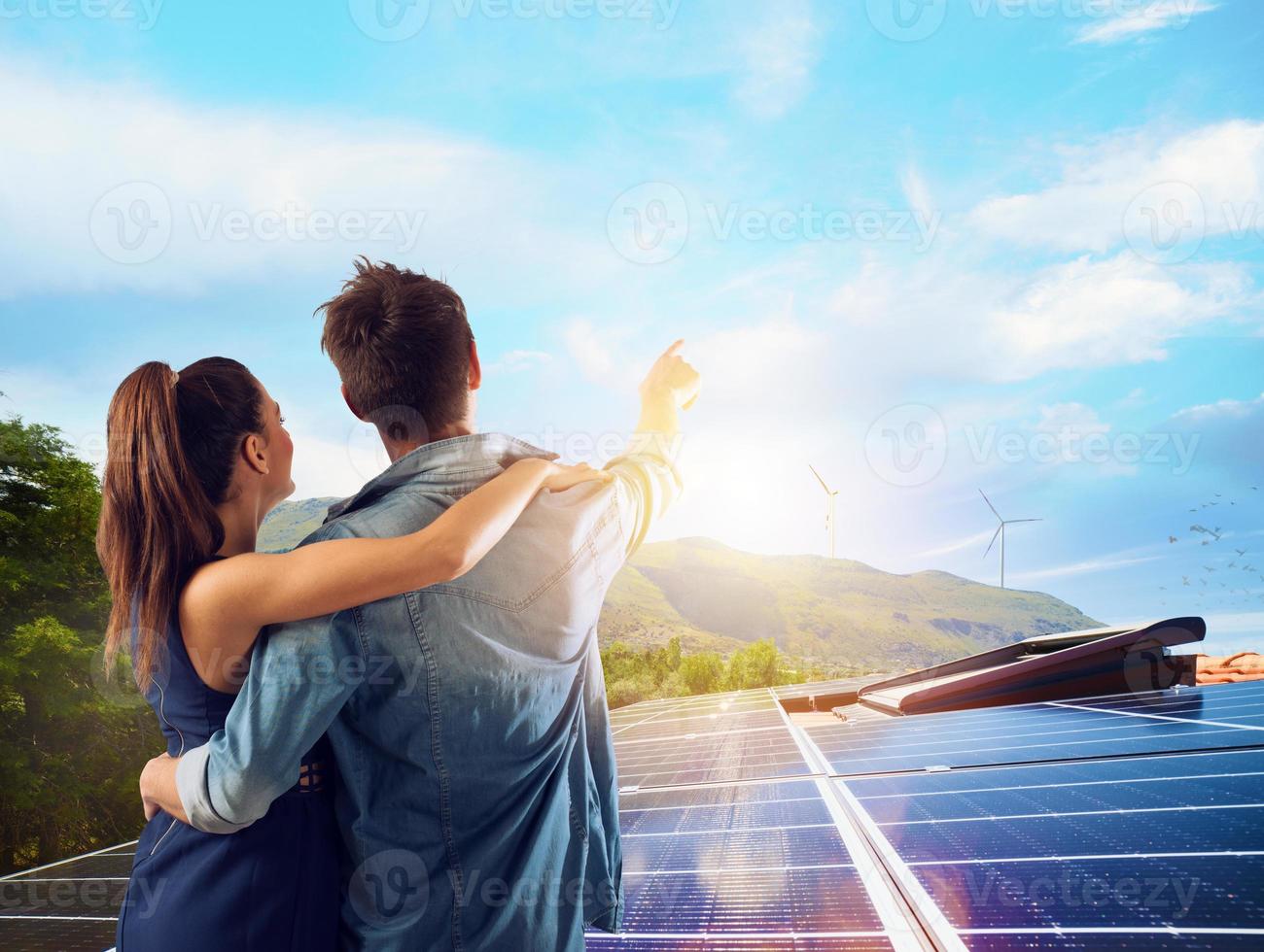 Family uses renewable energy system with solar panel photo
