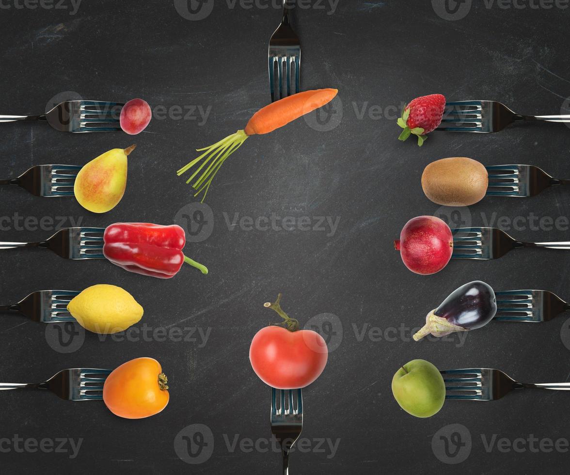 Background of forks with various vegetables and fruits photo