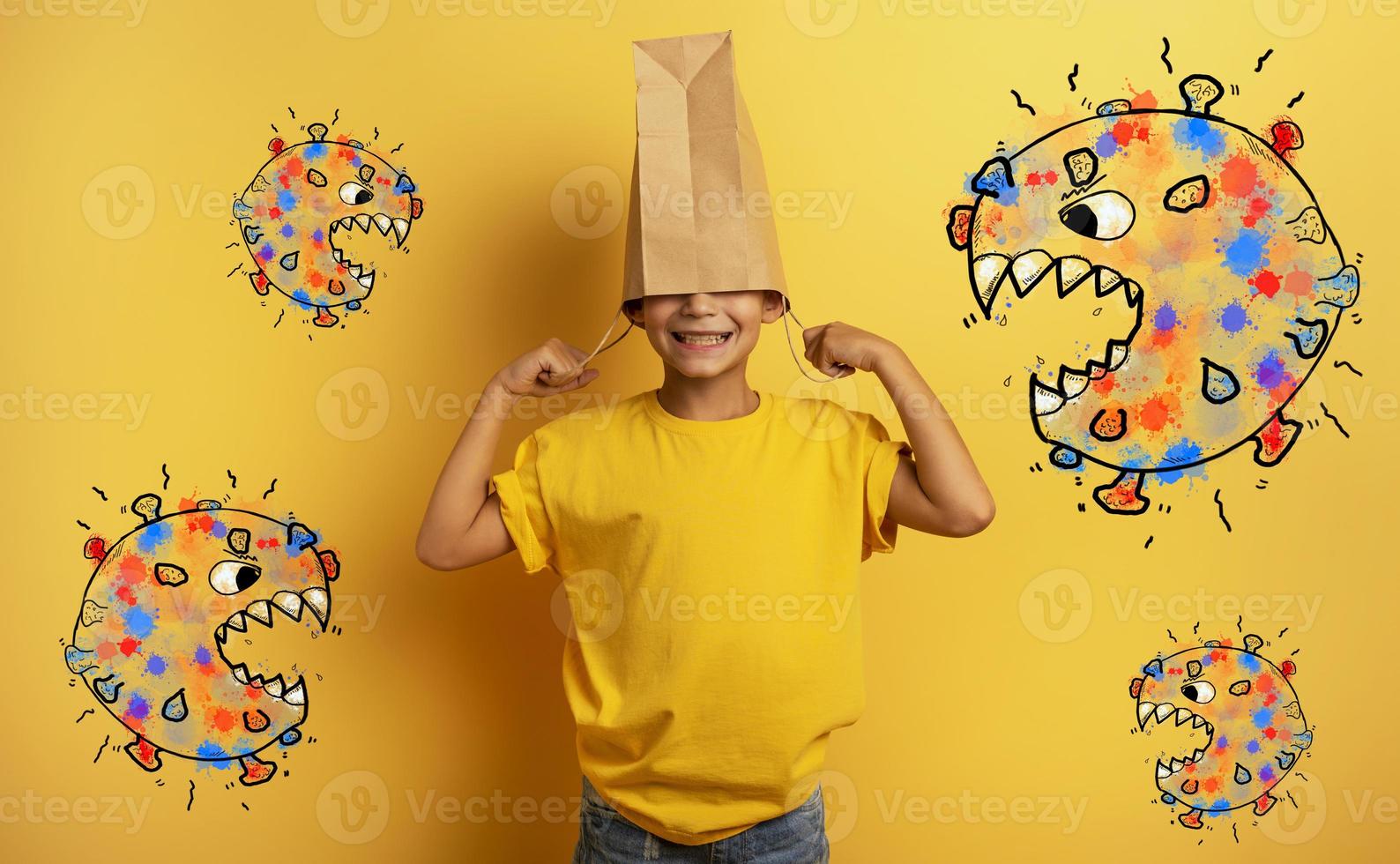 Child is afraid due to covid19 virus attack and hides his head inside a shopping bag photo