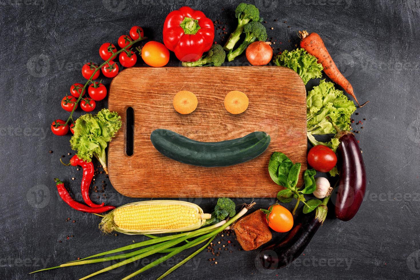Healthy background of vegetable with a shape of smile. Concept of genuine food photo