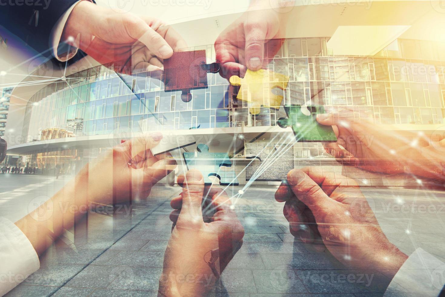 Teamwork of partners. Concept of integration and startup with puzzle pieces. double exposure photo