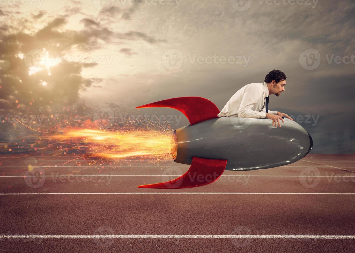 Businessman drives a fast rocket to win a challenge photo