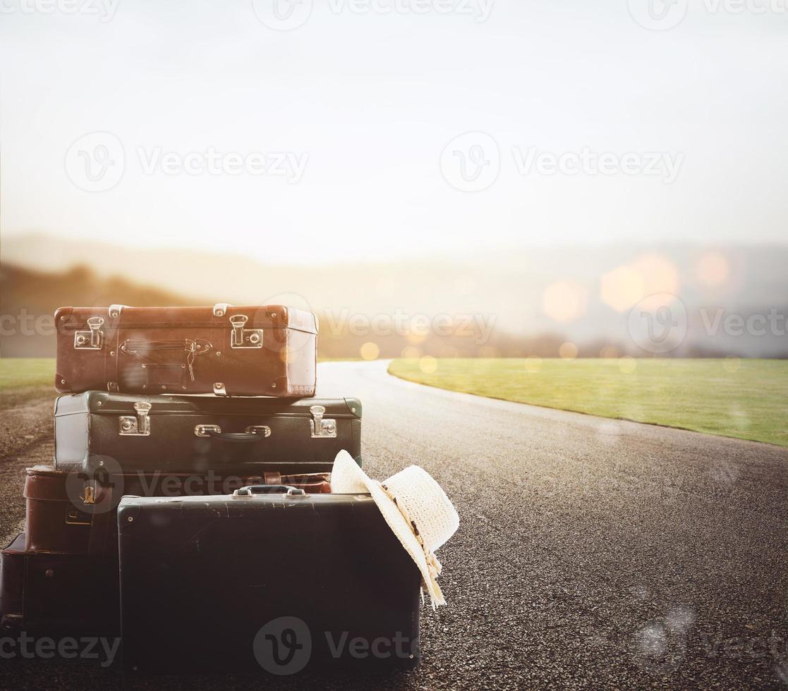 Luggage resting on asphalt photo