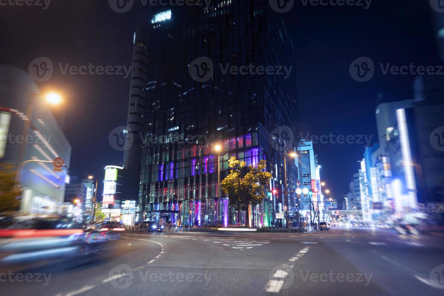 Skyscraper in the night in Osaka, Japan photo