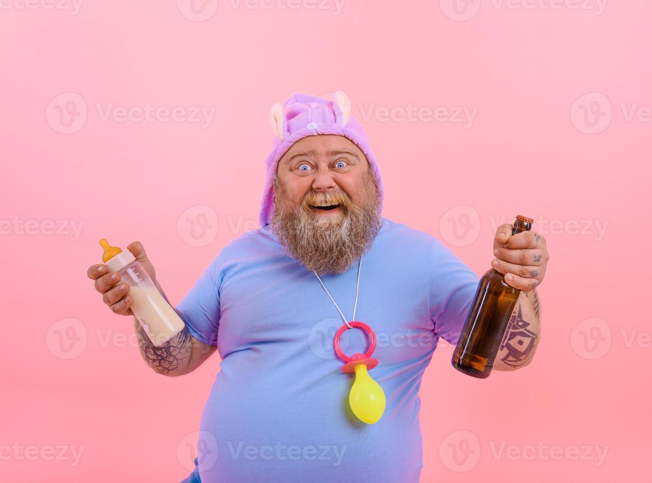 Fat amazed man acts like a amazed baby but drinks beer photo