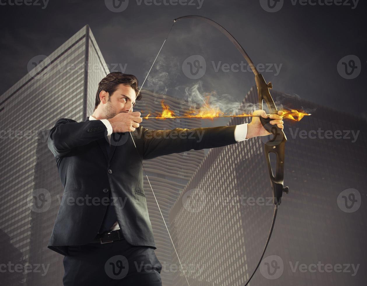 Businessman takes aim photo