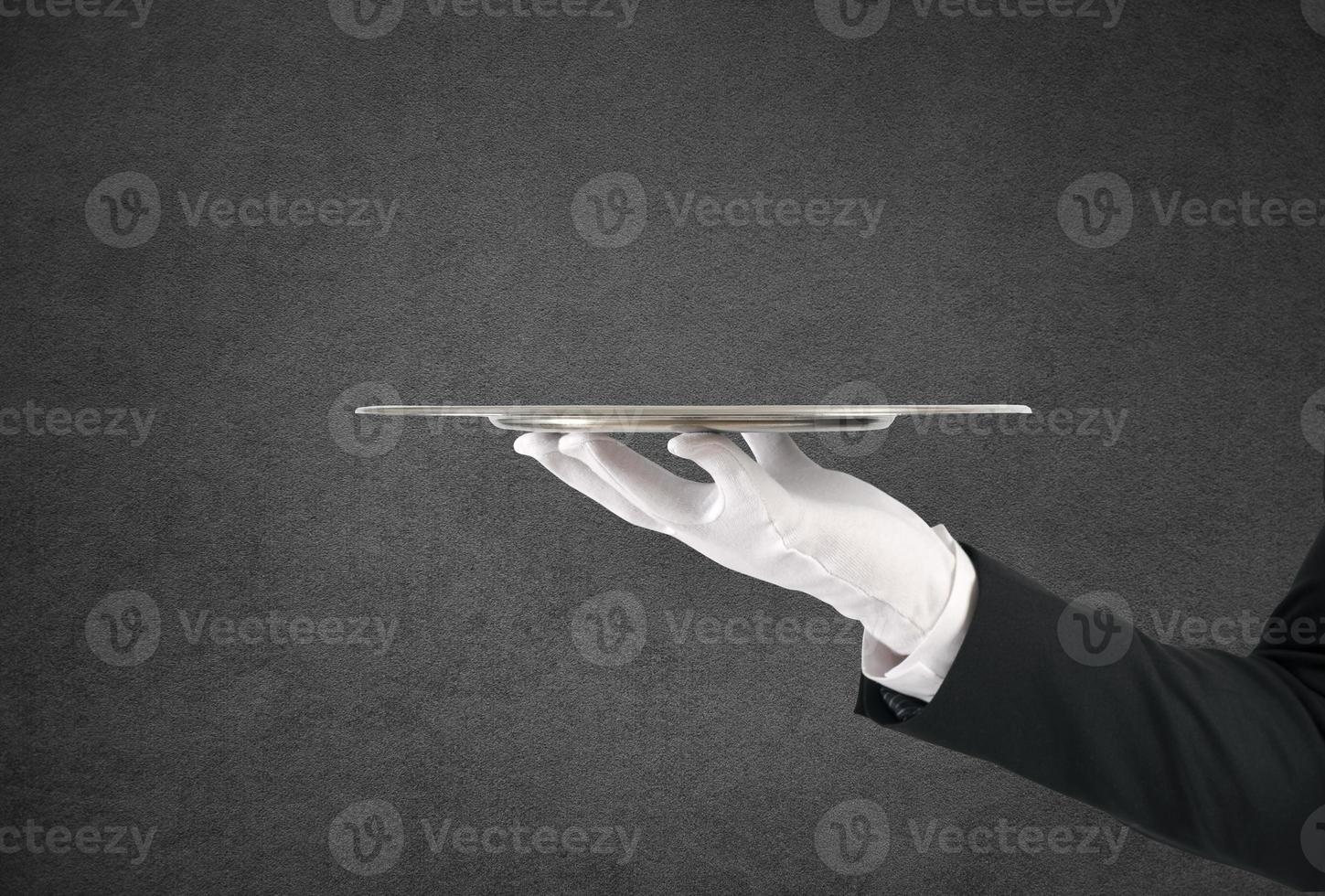 Waiter with tray. First class service concept photo