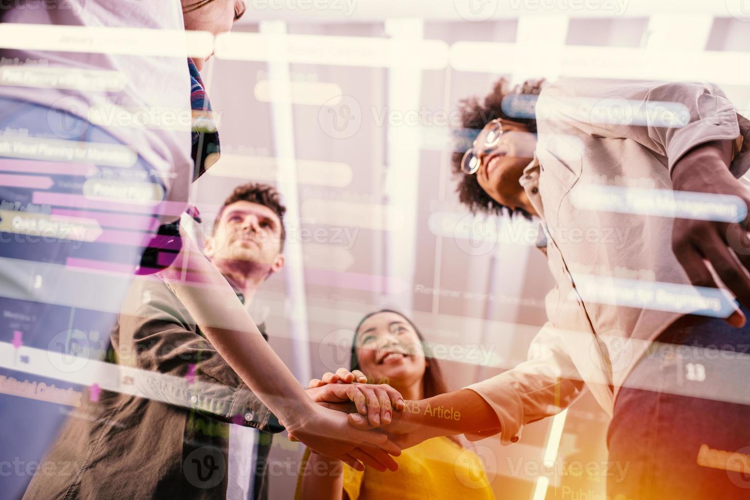 Business people putting their hands together. Concept of teamwork and partnership photo
