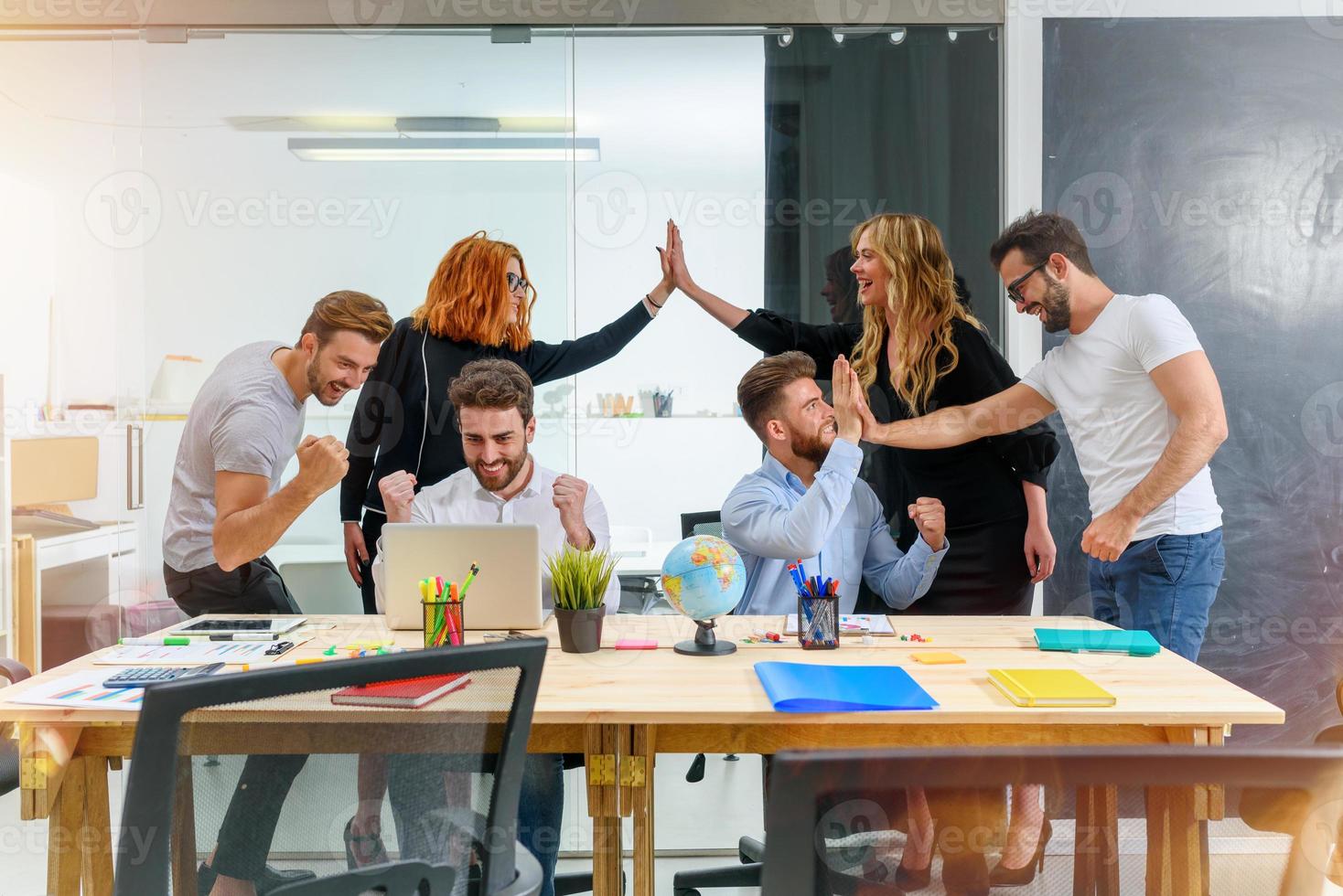 Business people are happy for the company trend and the success of the startup photo